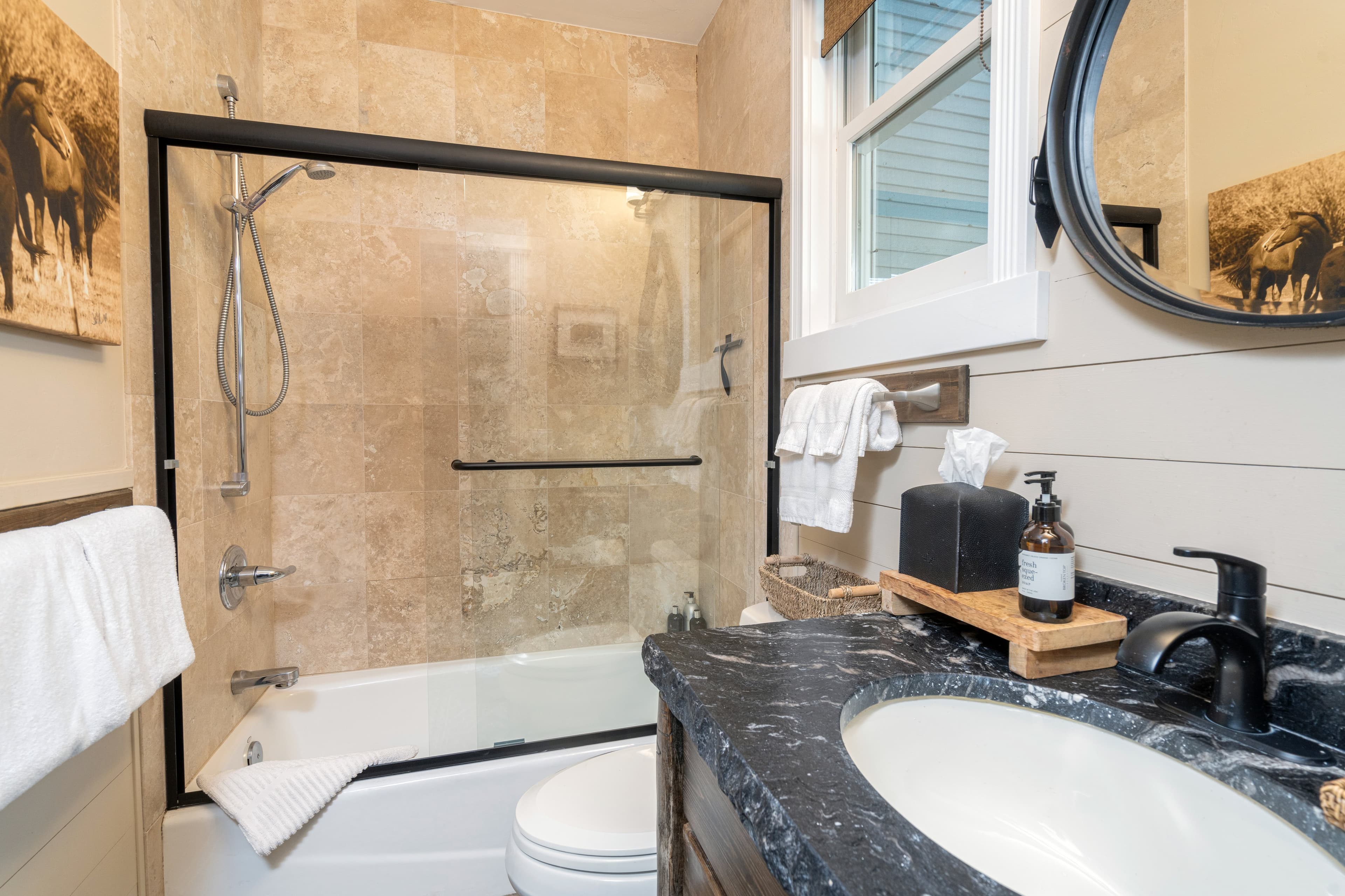 Guest bathroom located on first floor with a shower/tub.