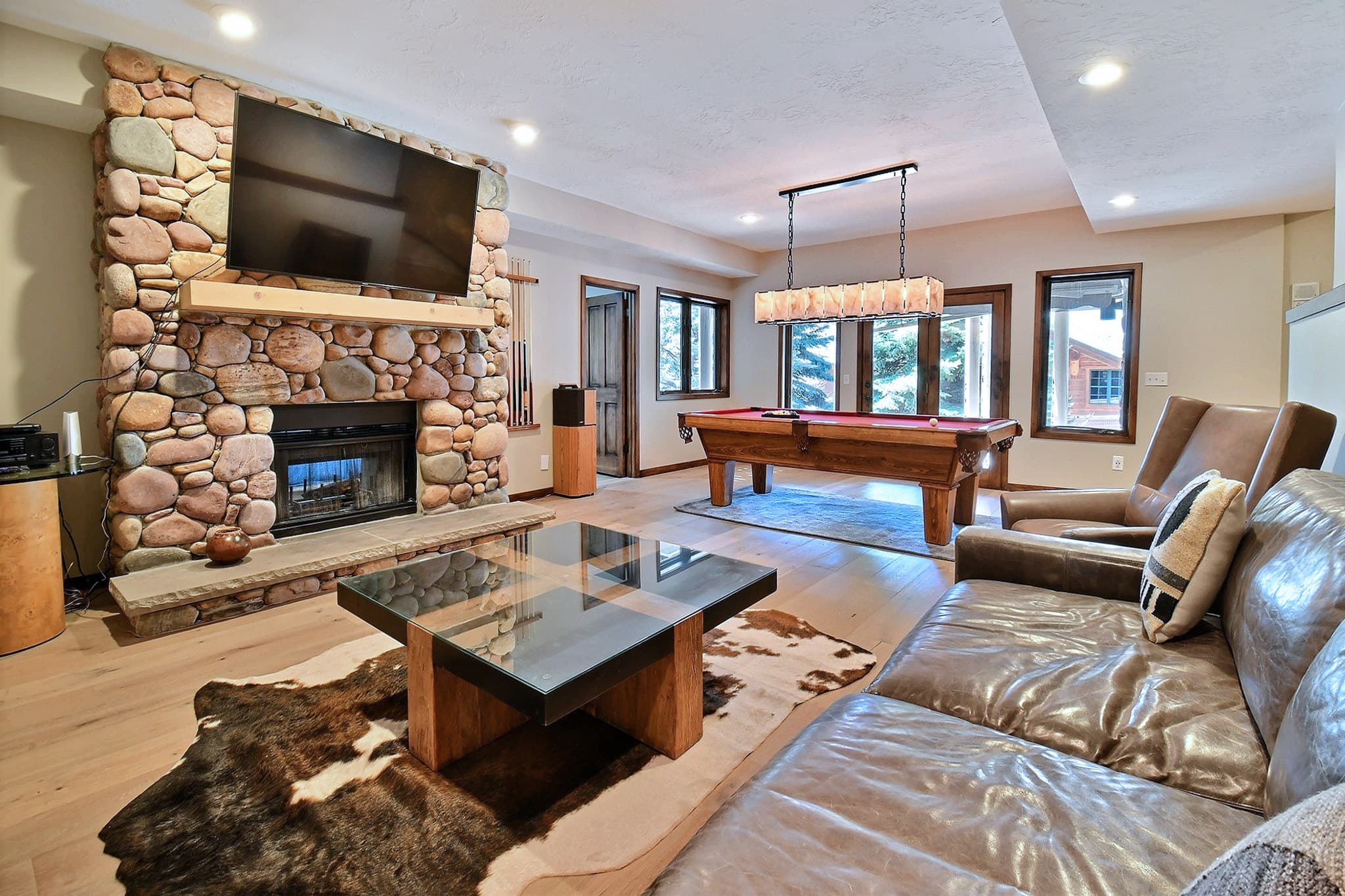 Secondary Living Space Featuring a Game Room, a Fireplace and a Flat Screen TV.