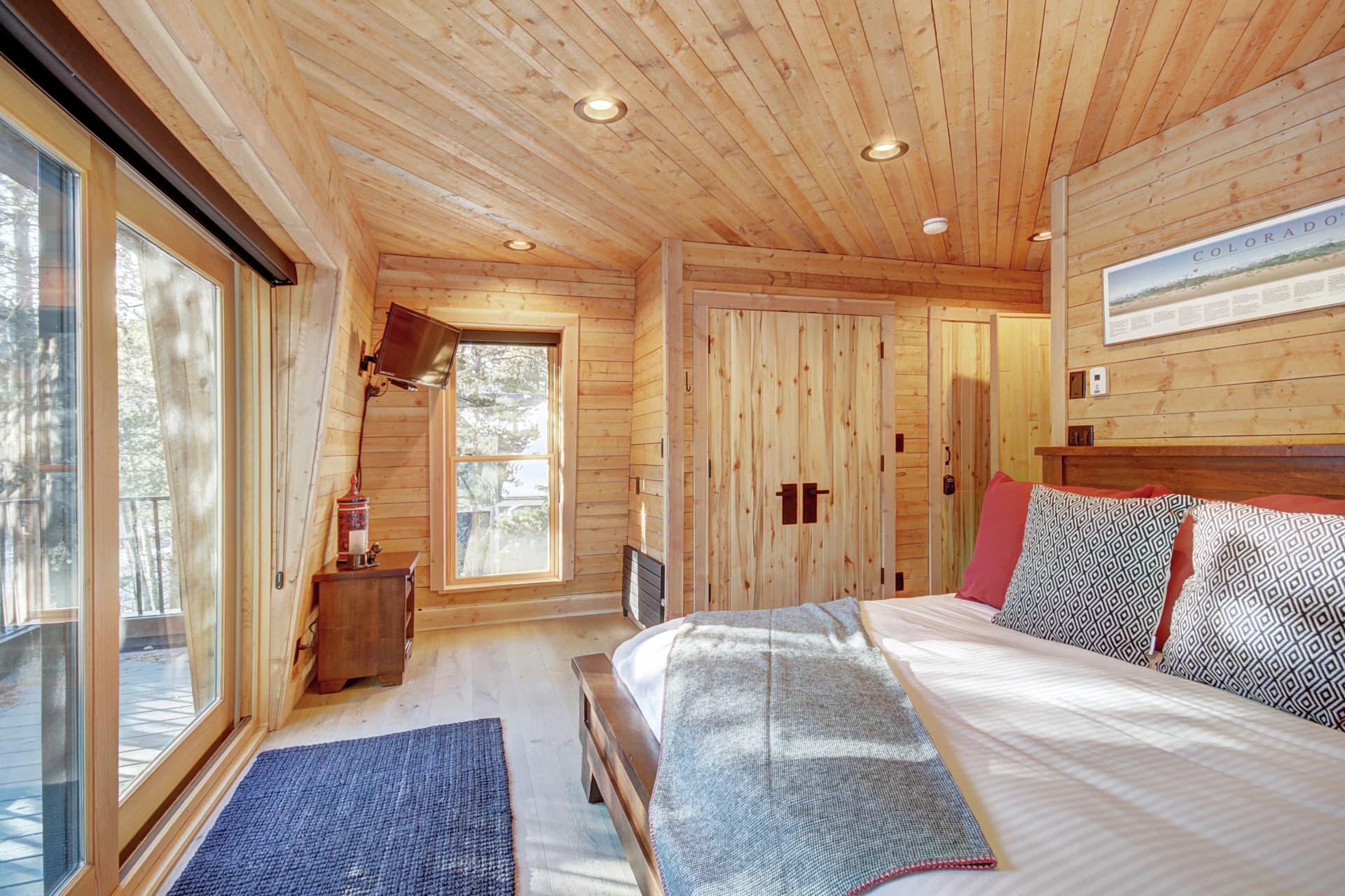 Upper level primary suite with King-size bed, private deck, and private bath - Arrow Darrow Breckenridge Vacation Rental